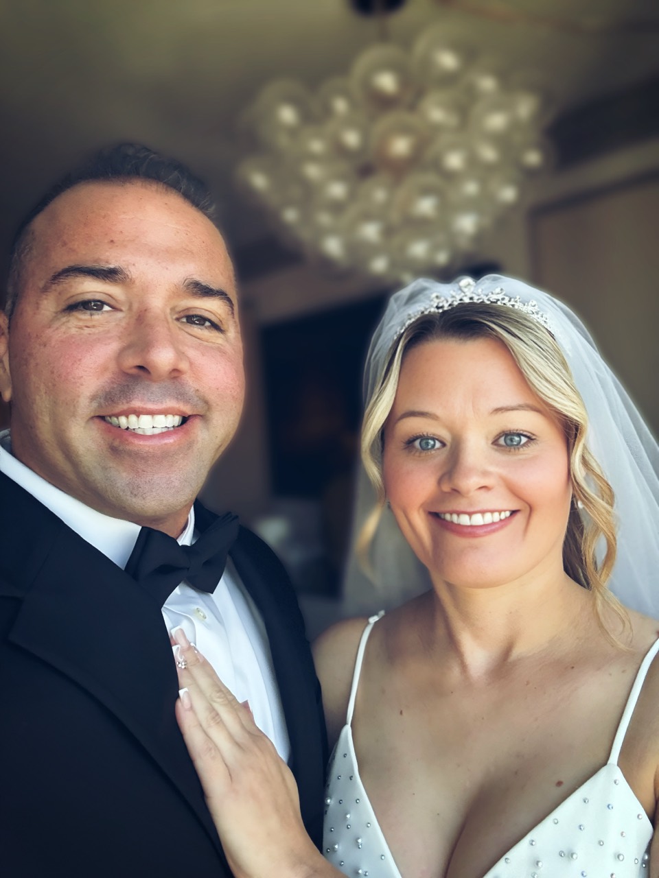 Jordan and Danielle smiling together in their first dressed-up hotel photo